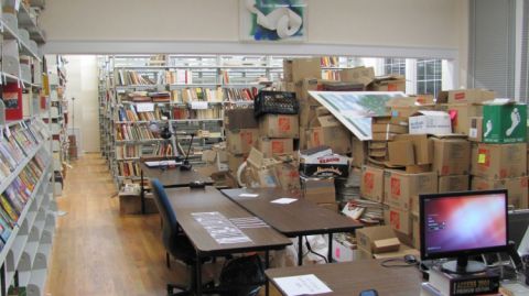 iew of the reading room and the collection room (on-the-right-books-in-boxes waiting for cataloging) March 2014